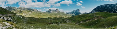 Photo for "The mountain pass Sedlo is in the north of Montenegro. Fantastic green view of Saddle mountain, Durmitor massive, Montenegro" - Royalty Free Image