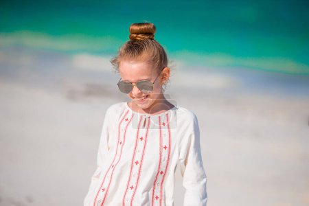 Photo for Adorable little girl at beach during summer vacation - Royalty Free Image