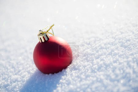 Photo for Red Christmas ball in fresh snow. Winter holidays concept - Royalty Free Image