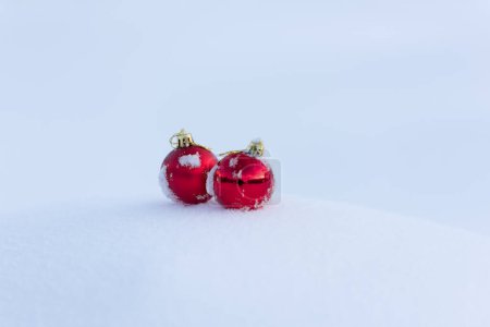 Photo for Red christmas balls in fresh snow - Royalty Free Image