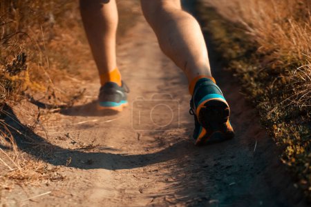Photo for Man is training, running, warming up outdoor. - Royalty Free Image