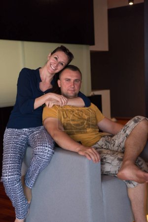 Photo for "young handsome couple hugging on the sofa" - Royalty Free Image