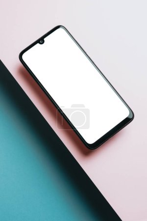 Photo for Top view of mobile phone screen blank template on pink and blue background with copy space, minimal design, shapes, colorful background, young style, transgender flag - Royalty Free Image