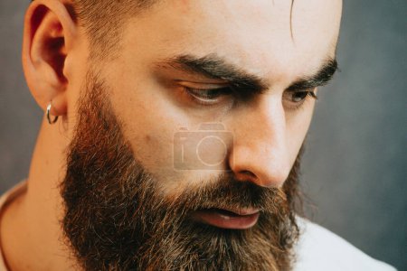 Téléchargez les photos : Portrait of a Young bearded hipster man, mental health and depression - en image libre de droit