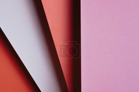 Foto de Abstract pink red orange and white and yellow color paper geometry composition background with shapes, minimalist shadows, copy space. Minimal geometric shapes. Colorful background concept - Imagen libre de derechos