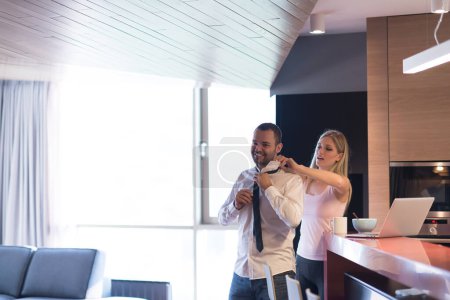Photo for A young couple is preparing for a job and using a laptop - Royalty Free Image