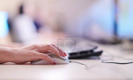 Photo for "Female hand holding computer mouse" - Royalty Free Image