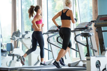 Photo for Women exercising on treadmill in gym - Royalty Free Image