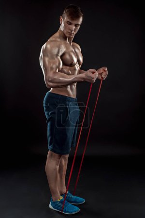 Photo for Young athletic man exercising - Royalty Free Image