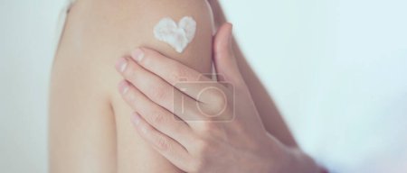 Photo for Woman gently cares for her body - Royalty Free Image