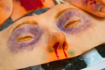 Photo for First Aid Training Mask.Layout for training doctors.Rubber face with wounds and sadines - Royalty Free Image