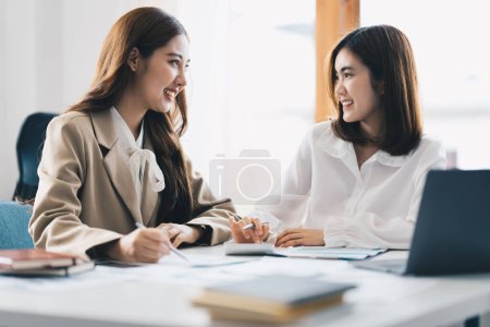 Photo for "At meeting room. Success Business woman showing the vision and consult to her business team." - Royalty Free Image
