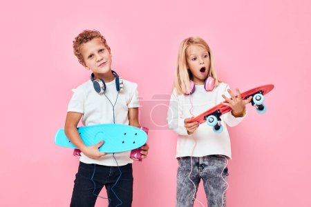 Photo for Active young people stand next to skateboards active lifestyle childhood - Royalty Free Image