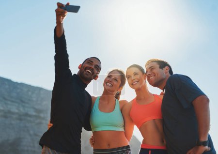 Photo for Take this for some fitness inspiration. Shot of a group of friends taking a selfie while out for a workout. - Royalty Free Image