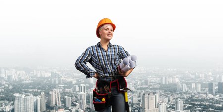 Photo for "Attractive female engineer in hardhat" - Royalty Free Image