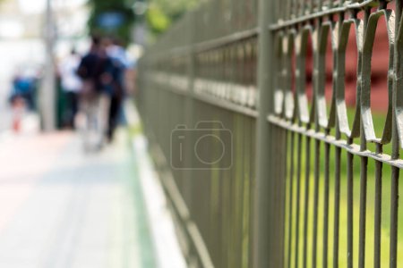 Photo for "Wrought iron fence beside a street in the city" - Royalty Free Image