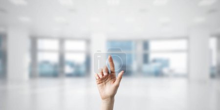 Photo for Choosing gesture of person in elegant modern interior in sunshine light - Royalty Free Image