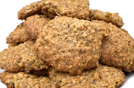 Photo for "Homemade oatmeal cookies in a pile isolated against white" - Royalty Free Image