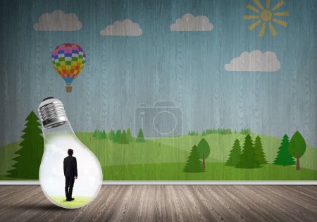 Photo for "Businessman trapped in bulb" - Royalty Free Image