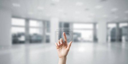 Photo for "Choosing gesture of person in elegant modern interior in sunshine light" - Royalty Free Image