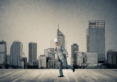 Photo for "King businessman in elegant suit running and drawn cityscape silhouette at background" - Royalty Free Image