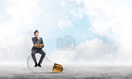 Photo for Young businessman with a book - Royalty Free Image