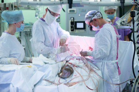 Foto de "Surgical operating room in a hospital with doctors who perform surgery on a man." - Imagen libre de derechos