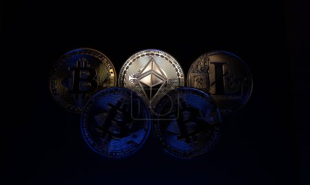 Photo for "Bitcoin, Ethereum and Litecoin on dark backdrop. Cryptocurrency coins, concept of digital trading and blockchain technology" - Royalty Free Image
