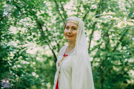 Photo for "happy woman pagan priestess prepared for the ceremony. old faith in our time. seasons, summer." - Royalty Free Image