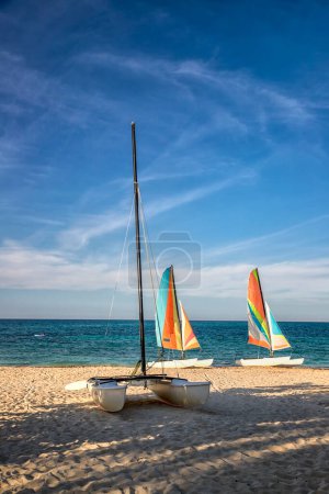 Photo for Colorful sail catamarans on the beach. The tropical resort area with the most beautiful beaches - Royalty Free Image