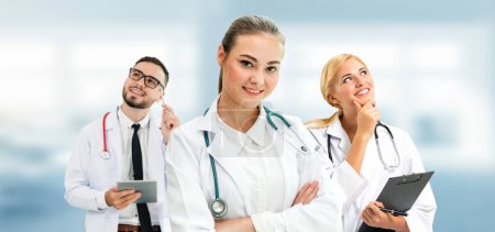 Photo for Doctor working in hospital with other doctors. - Royalty Free Image