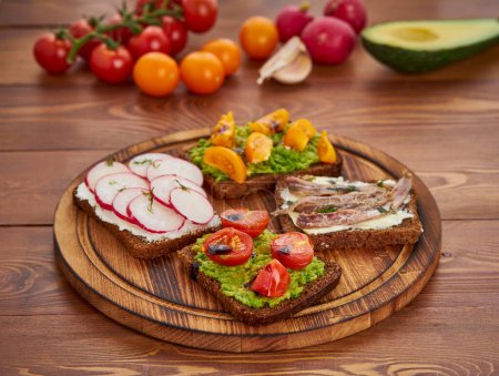 Photo for Smorrebrod - traditional Danish sandwiches. Black rye bread with fish - Royalty Free Image