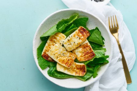 Photo for "keto ketogenic diet haloumi with lettuce on pastel background closeup" - Royalty Free Image