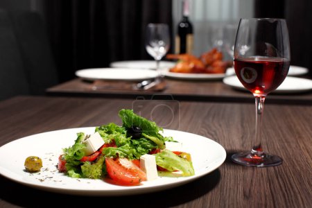 Photo for "luxury dinner served on the table with glass of red wine" - Royalty Free Image