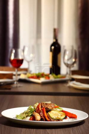 Photo for "luxury dinner served on the table with glass of red wine" - Royalty Free Image