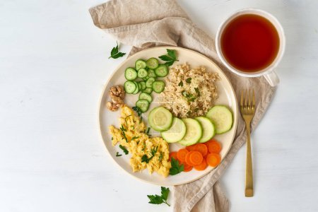 Photo for Balanced gluten free food, brown rice zucchini with scramble, dash fodmap diet - Royalty Free Image