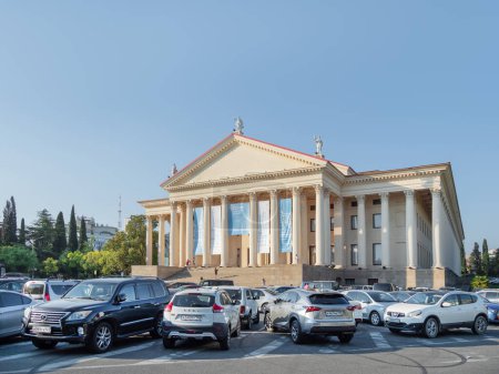 Photo for "SOCHI, RUSSIA - May 27, 2021. Cars parked in front of Winter Theater or Zimniy Theatre at sunny day." - Royalty Free Image