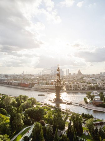 Photo for "MOSCOW, RUSSIA - June 14, 2021. Panorama of Moscow at sunset - monument to Petr the Great, Bolotnaya and Prechistanskaya embankment." - Royalty Free Image