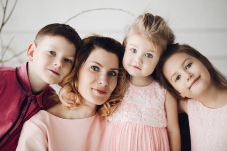 Photo for Portrait of cute family looking at camera and smiling - Royalty Free Image