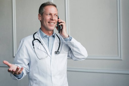 Photo for Doctor making phone call - Royalty Free Image