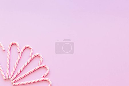 Photo for Design made with xmas candy cane pink background corner - Royalty Free Image