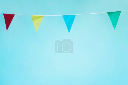 Photo for "colorful pennant garland on background, close up - Royalty Free Image