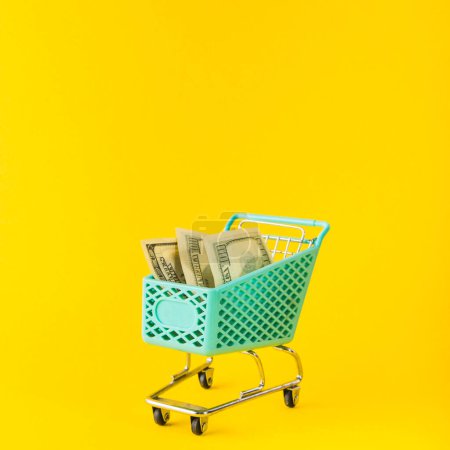 Photo for Grocery cart with money - Royalty Free Image