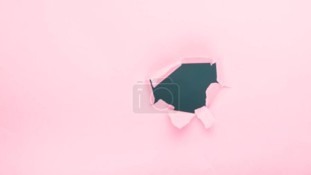 Photo for Hole in pink paper - Royalty Free Image