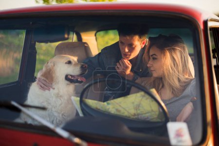 Photo for Young family road trip with their dog - Royalty Free Image
