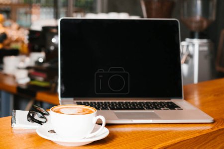 Photo for Front view of laptop coffee on wooden surface - Royalty Free Image