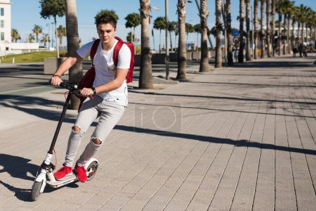 Photo for Teenage boy with scooter - Royalty Free Image