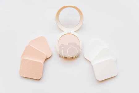 Photo for Face cosmetic compact makeup powder with sponges white background - Royalty Free Image