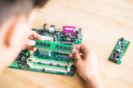Photo for "technician testing ram computer motherboard table" - Royalty Free Image