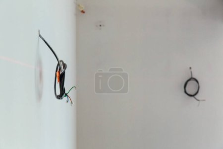 Photo for "Exposed electrical wires on wall" - Royalty Free Image